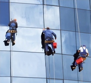Window washers hanging on a rope.